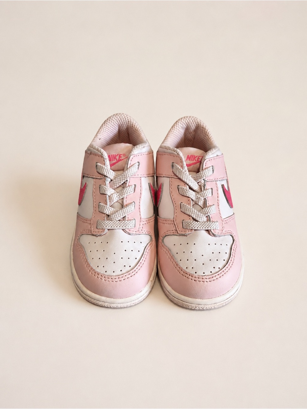 Nike Kids Pink and White Low-Top Sneakers with Pink Swoosh